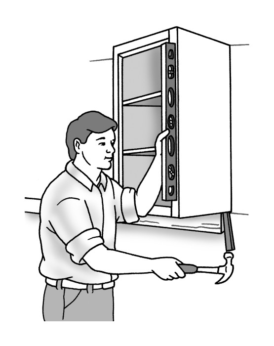 Figure 2-6: Use shims to make a cabinet plumb.